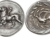 a close up of a coin with a horse and a bird on it