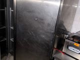 an image of a kitchen with a stainless steel refrigerator
