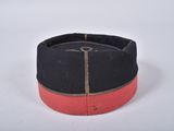a black hat with a red band on it