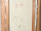 an old picture frame with a drawing of a bird on it