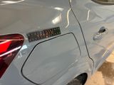a close up of a car with a sticker on the side of it