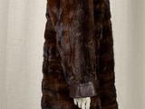 a close up of a fur coat on a mannequin mannequin