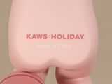 a pink teddy bear sitting on top of a pink chair