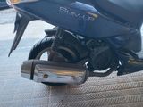 a close up of a motorcycle parked on the street