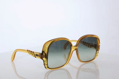 an image of a pair of sunglasses sitting on top of a table