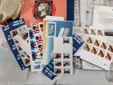 a lot of stamps and envelopes on a table