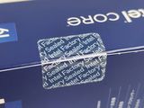 a close up of a blue box with a sticker on it