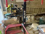 a red crane that is sitting in a garage