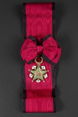 an image of a red ribbon with a star and a star on it