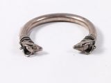 a close up of a silver ring with a horse ' s head on it