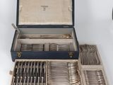 a box with a bunch of silverware in it