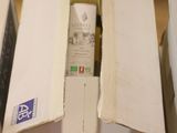 several boxes of wine are stacked on top of each other on a table