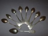 a lot of spoons that are sitting on a table