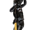 an image of a statue of a boy holding a lamp post