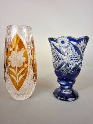 two vases sitting next to each other on a table