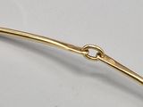 a gold plated hair pin with a knot on it