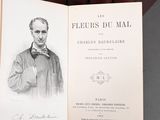 an open book with a drawing of a man in a bow tie