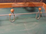 a wooden table with a net on top of it