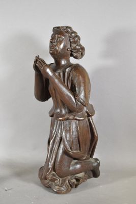 pair of carved wood figures of a woman kneeling and praying