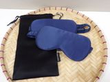 two pairs of eye masks and a pouch on a tray
