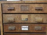 an old chest of drawers that has a sign on it