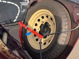a car that has a tire on the back of it
