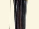 a black and gold lamp on a white background