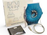 a box with a watch and a cable in it