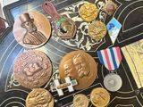 a table with a lot of medals and medals on it