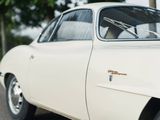 a white car parked on the side of the road