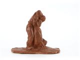 a chocolate figurine of a man and a dog