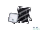 a close up of a solar powered flood light with a white background