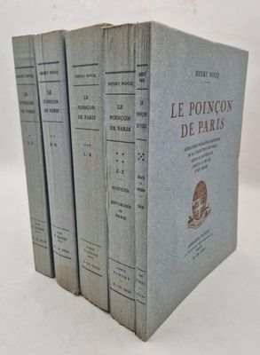 three books are stacked on top of each other on a white surface