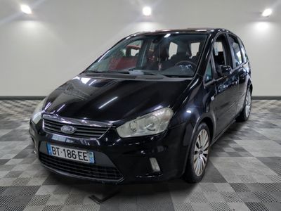 a picture of a small black car parked in a garage