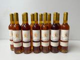 six bottles of wine are lined up in a row