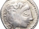 une pièce de monnaie en argent portant l'image d'un visage de femme