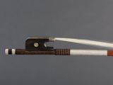 a close up of a violin bow with a string attached to it