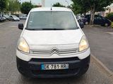 a white van that is parked in a parking lot