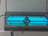 an image of a blue light on a metal shelf