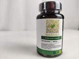a bottle of vitamin supplement sitting on a table