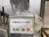 a robot that is sitting on a conveyor belt