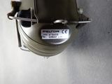an overhead view of a compressor on a table with a label on it