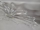 a clear glass bowl with a yellow flower on it