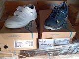two pairs of shoes sitting on top of boxes