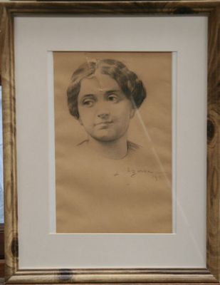 portrait of a woman with a veil on her head in a wooden frame