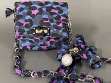 purple and blue leopard print purse with chain strap and matching bow