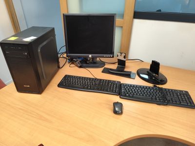 a desktop computer sitting on a desk with a keyboard and mouse