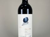 a bottle of wine that is sitting on a table