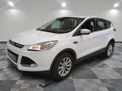 the white ford kuga is parked in a large room