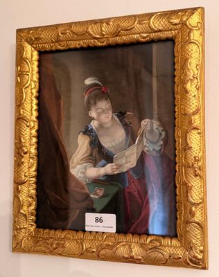 un tableau représentant une femme en train de lire un livre, dans un cadre doré